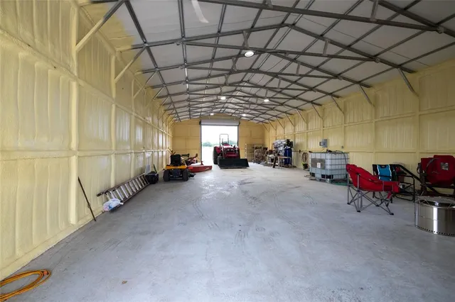 a view of a yard with potted plants