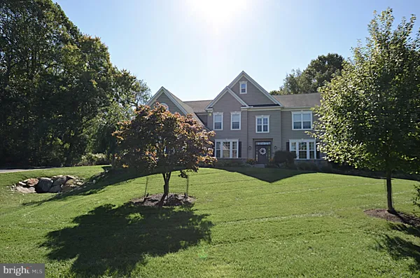 a view of a front of a house with a yard