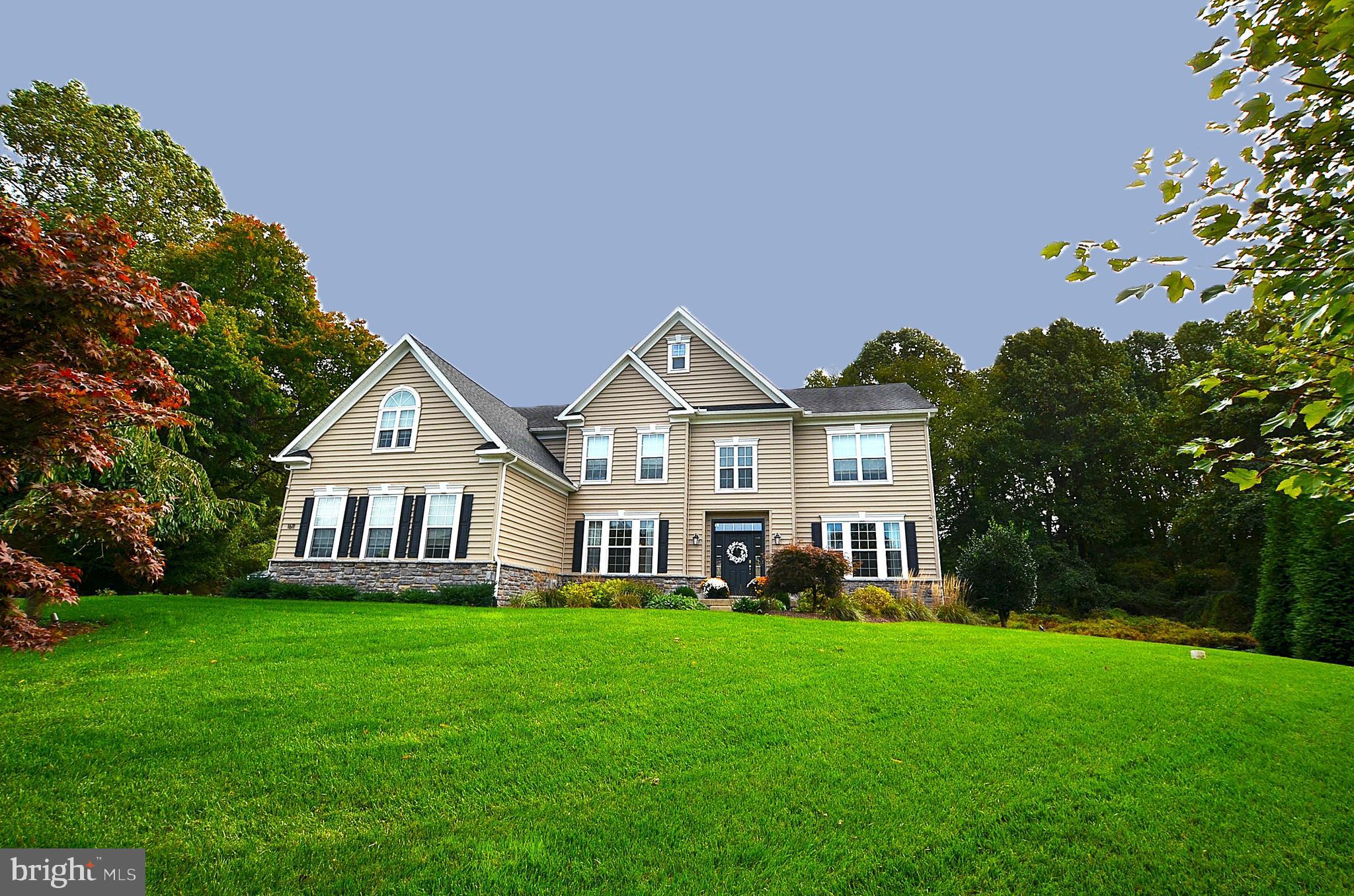 1611 Brackenville Road Hockessin, DE 19707 - Photo 1 of 1 a front view of a house with a yard and green space
