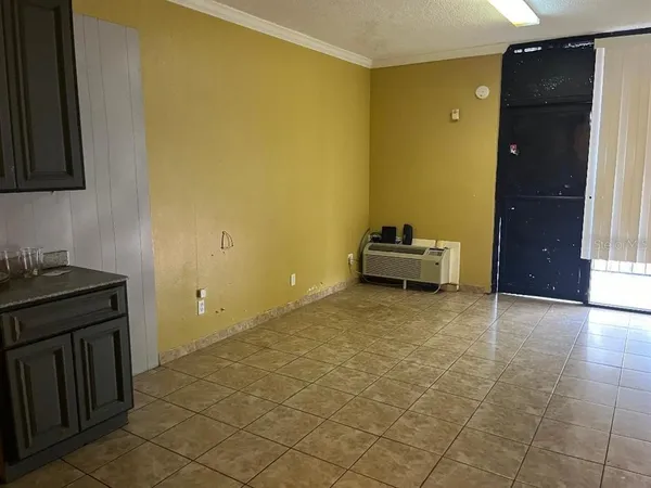 a room with a bed and cabinets