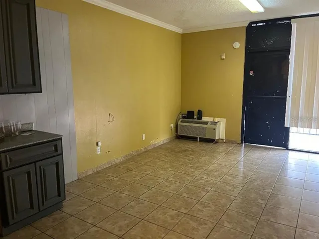 a room with a bed and cabinets