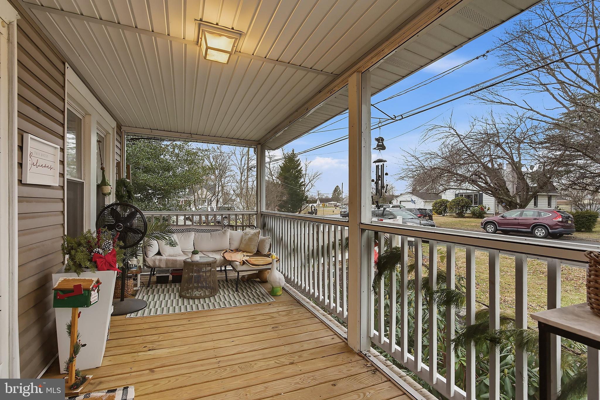 174 Crest Avenue Hamilton, NJ 08690 - Photo 5 of 29 a view of balcony with chairs and wooden floor