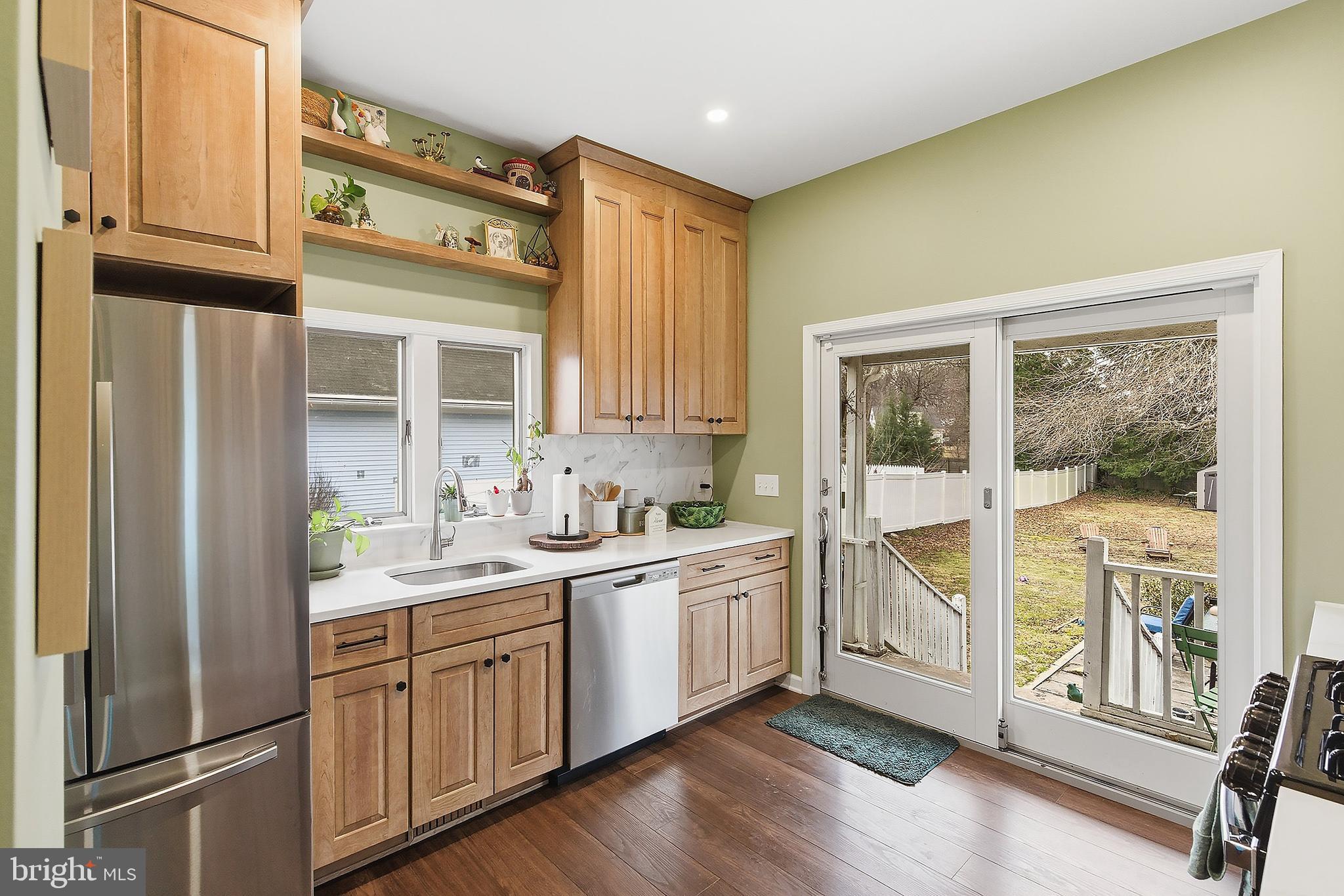 174 Crest Avenue Hamilton, NJ 08690 - Photo 10 of 29 a kitchen with a sink cabinets stainless steel appliances and a window