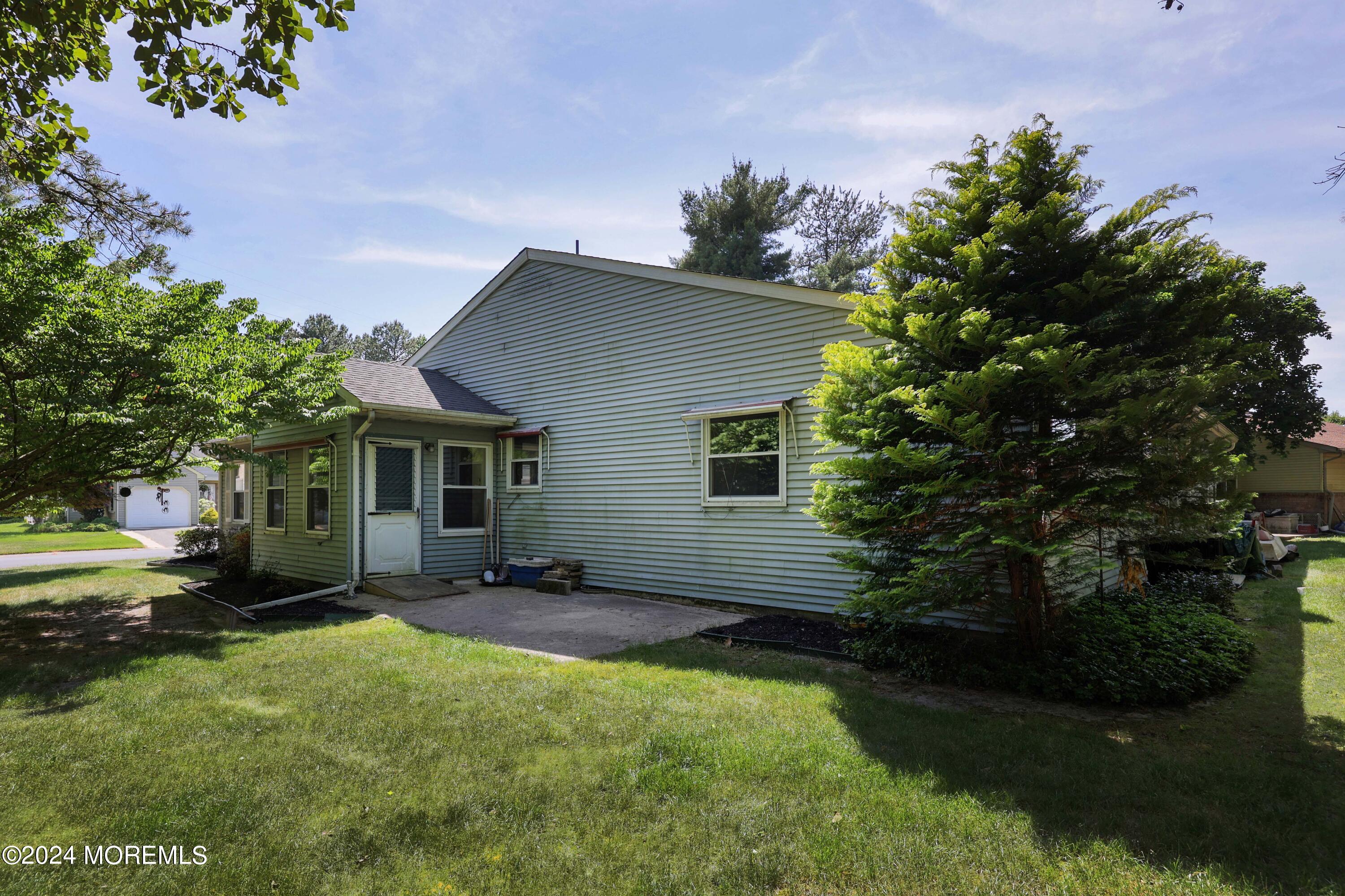 147A Sunset Road, Unit B Whiting, NJ 08759 - Photo 17 of 23 a view of a house with a yard