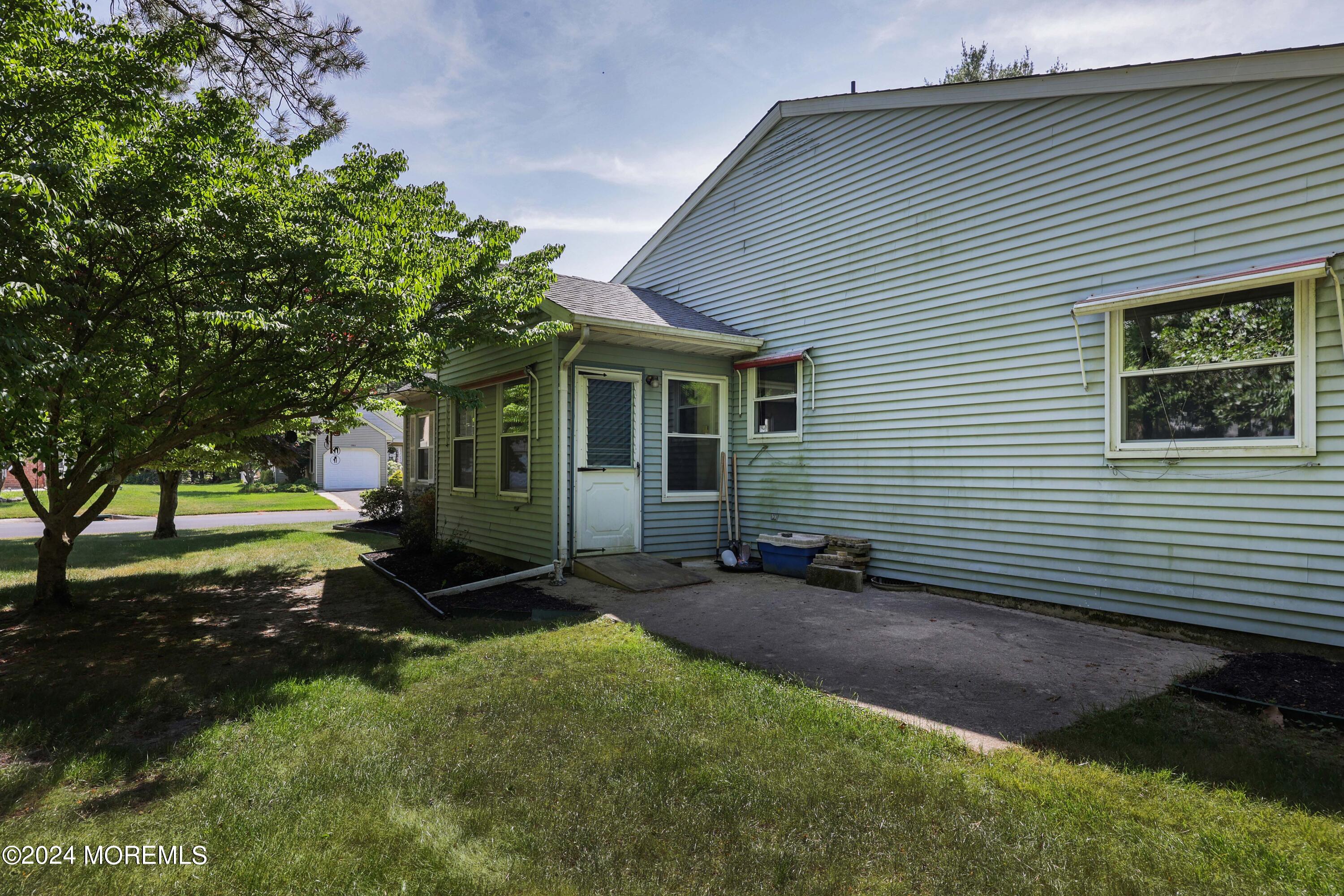 147A Sunset Road, Unit B Whiting, NJ 08759 - Photo 18 of 23 a view of a house with a yard