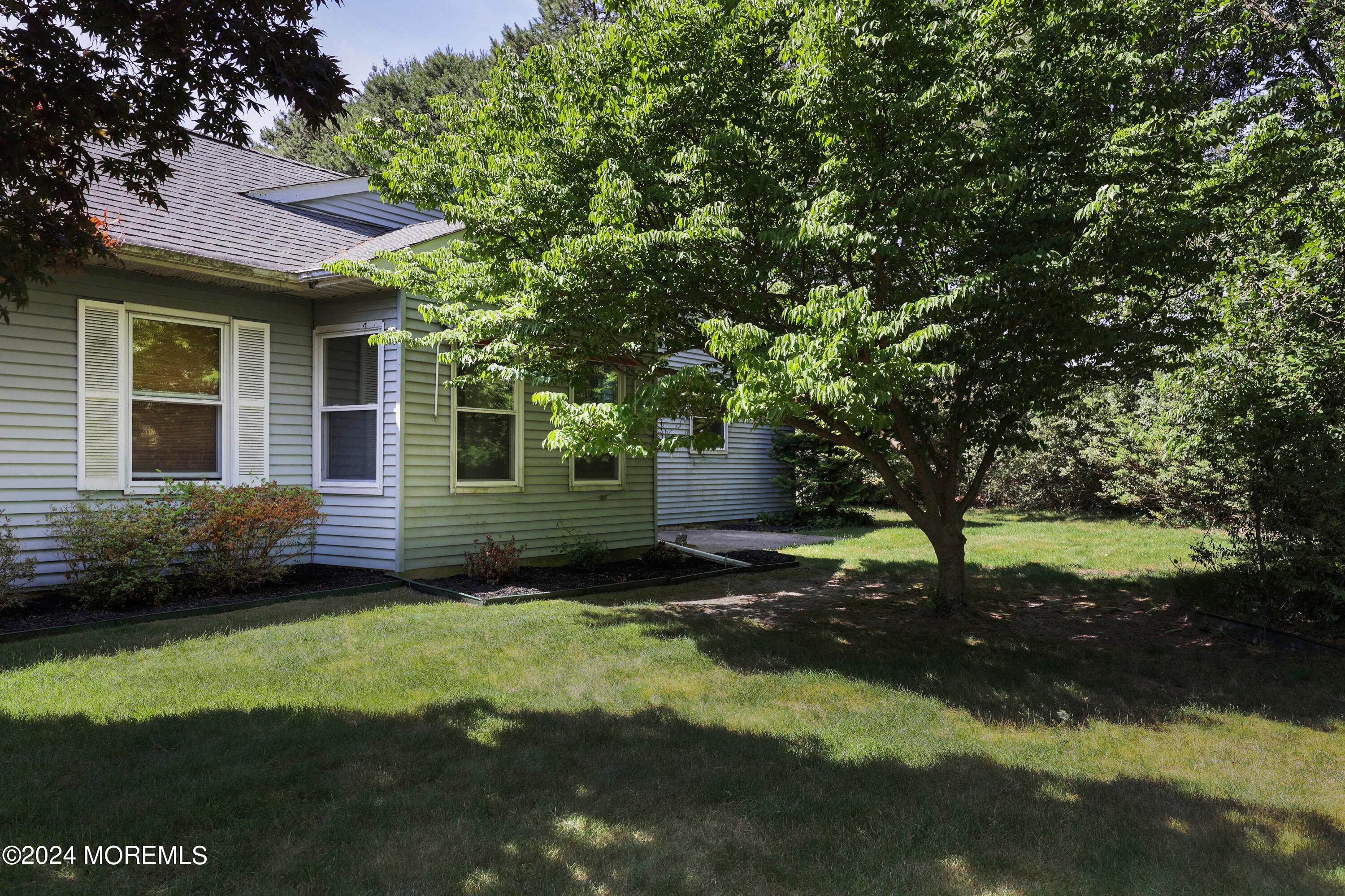 147A Sunset Road, Unit B Whiting, NJ 08759 - Photo 20 of 23 a view of a backyard with a garden