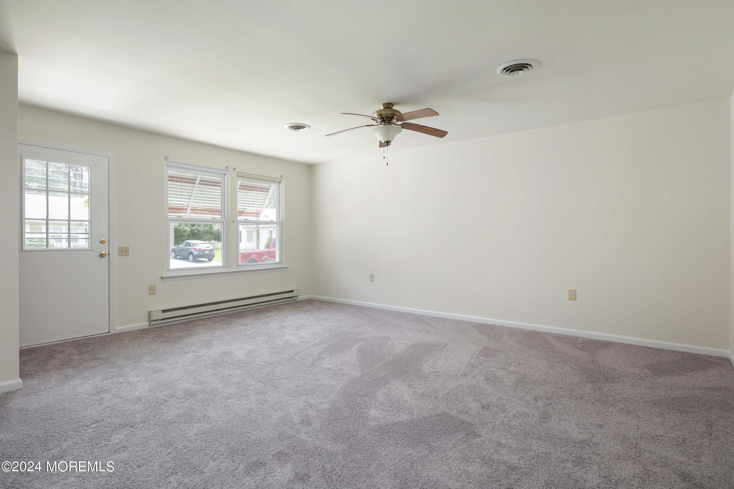147A Sunset Road, Unit B Whiting, NJ 08759 - Photo 3 of 23 an empty room with windows