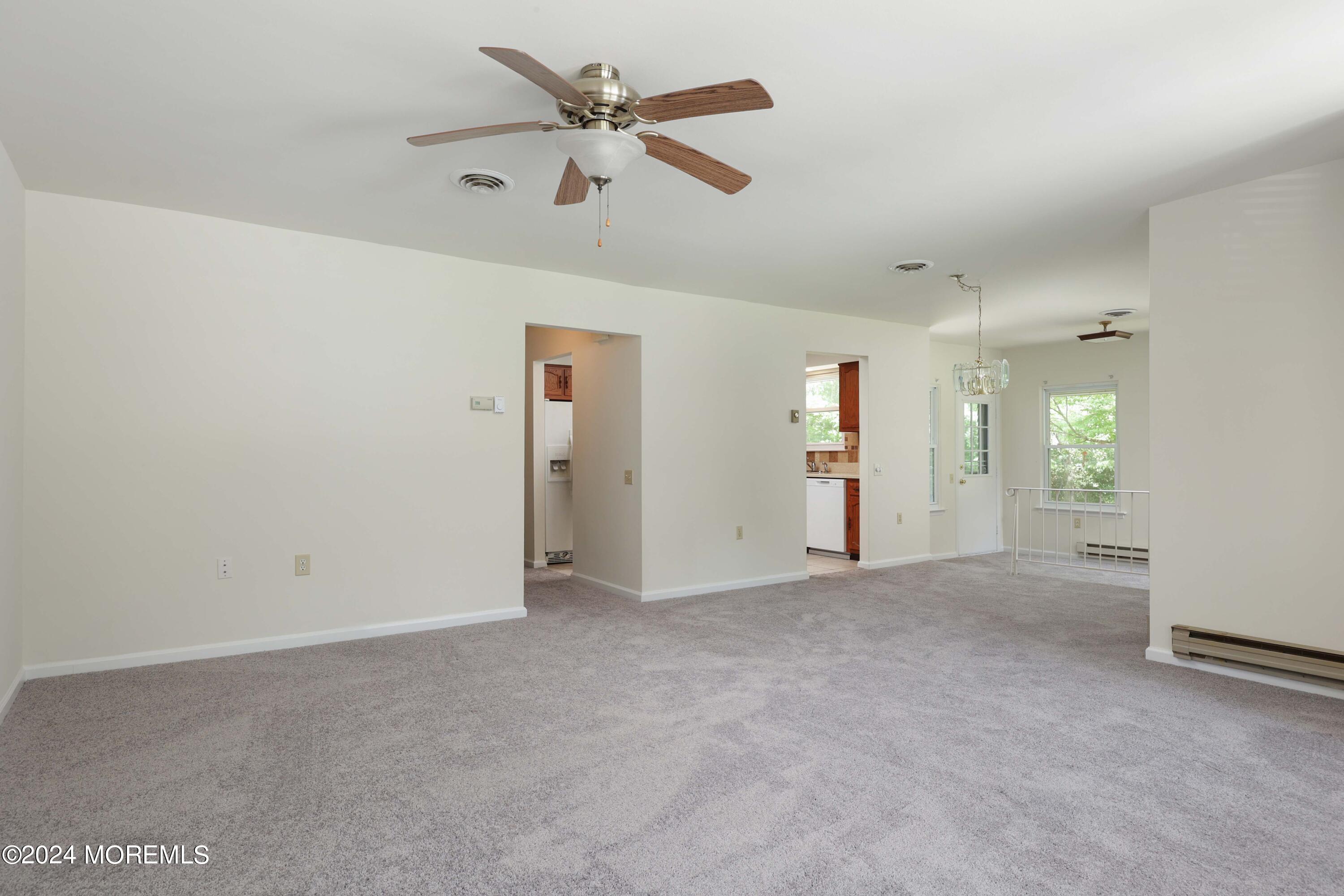147A Sunset Road, Unit B Whiting, NJ 08759 - Photo 5 of 23 an empty room with closet and windows