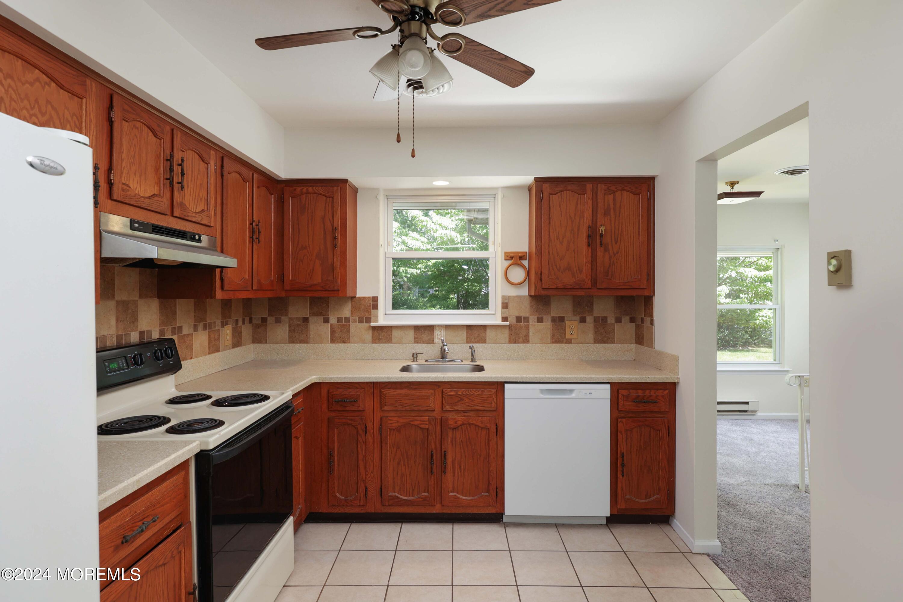147A Sunset Road, Unit B Whiting, NJ 08759 - Photo 10 of 23 a kitchen with a sink a stove and cabinets