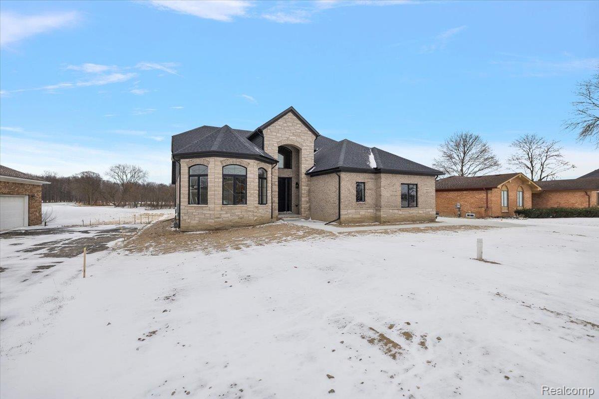 53650 Romeo Plank Road Macomb, MI 48042 - Photo 63 of 64 French provincial home with stone siding and brick siding