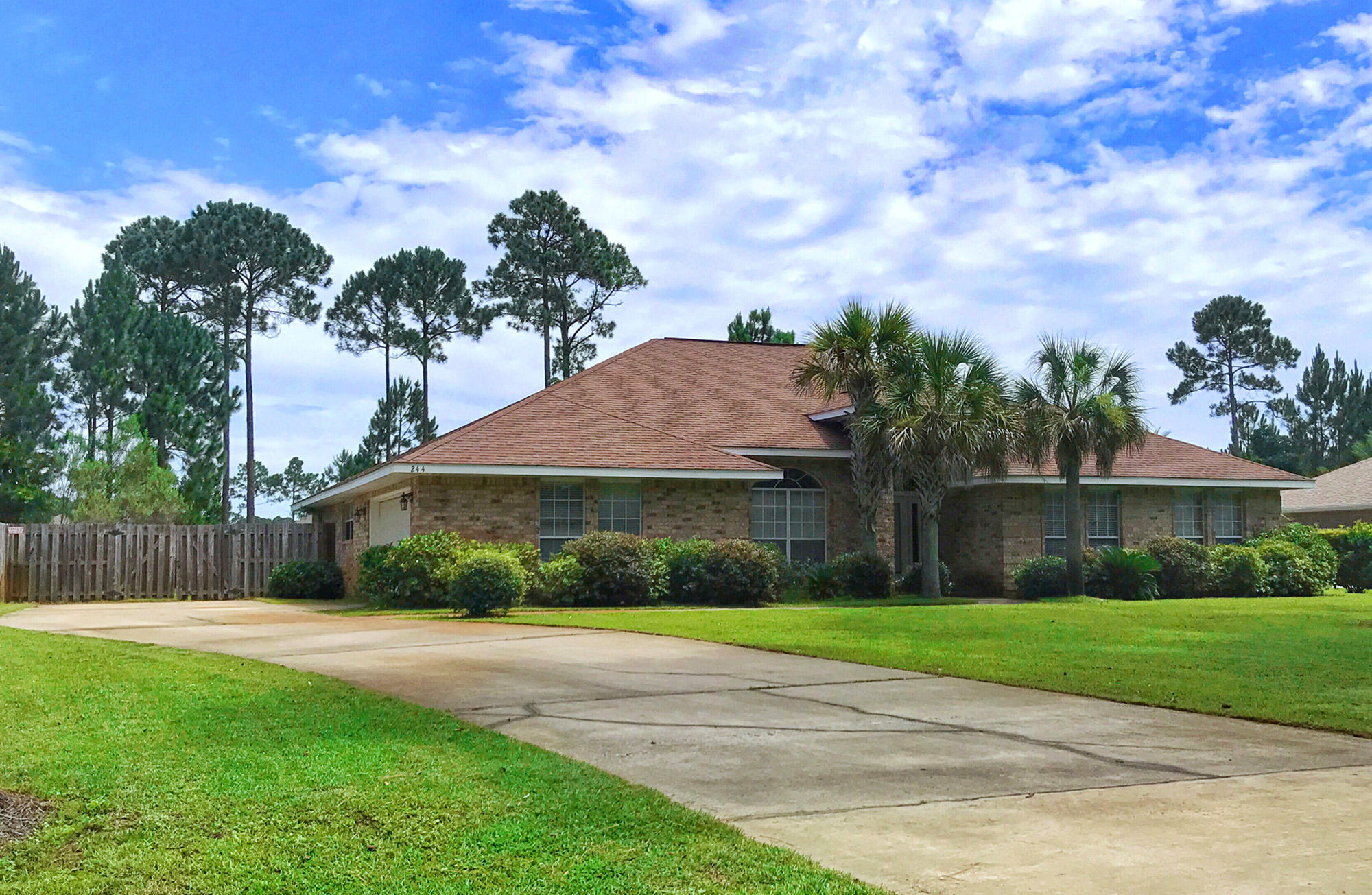 244 Shipwreck Road Santa Rosa Beach, FL 32459 - Photo 3 of 41 a front view of a house with garden