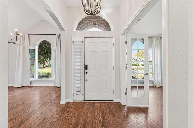 a view of livingroom with furniture wooden floor and windows