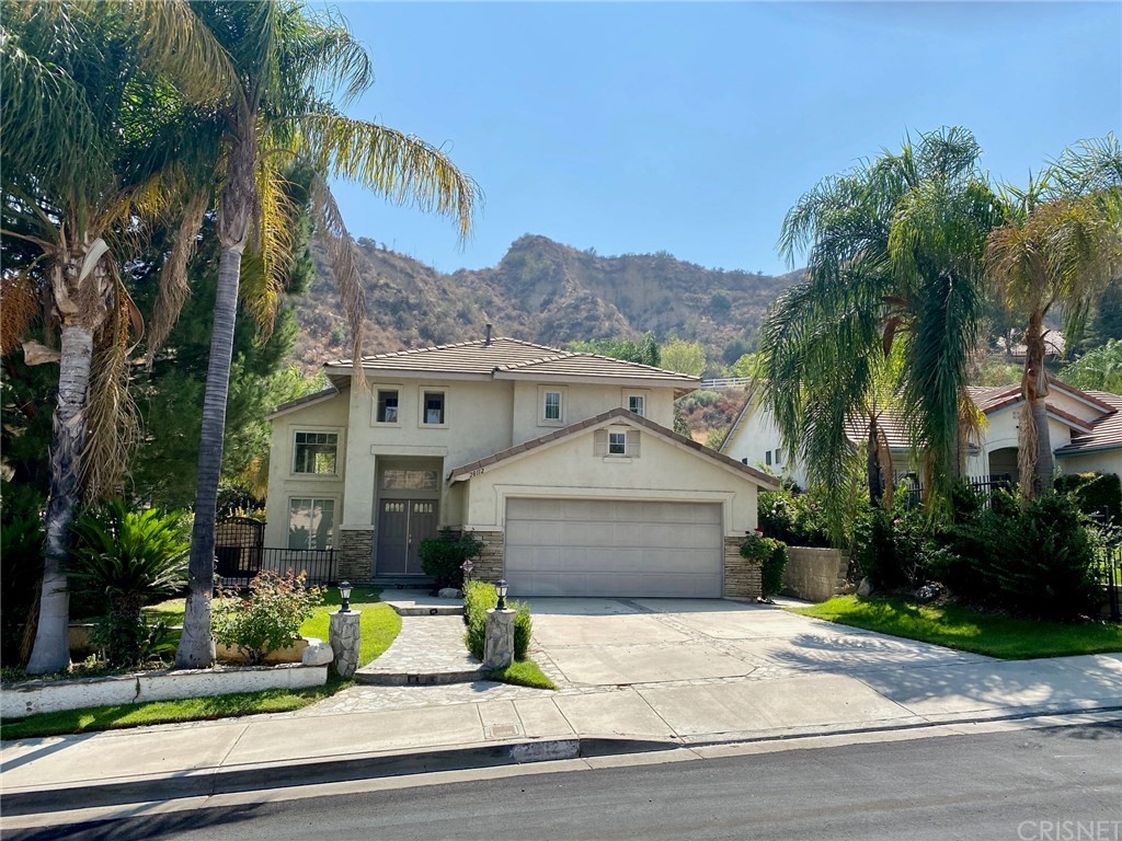28112 Cascade Road Castaic, CA 91384 - Photo 1 of 1 a front view of a house with a garden