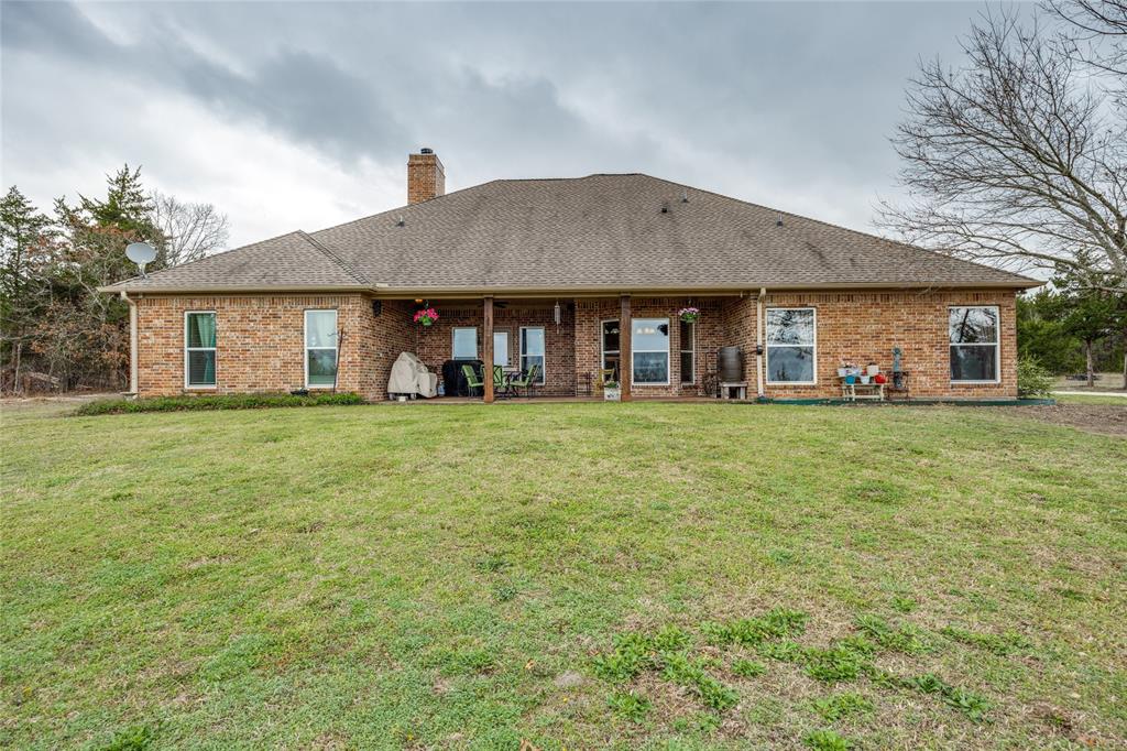 1462 Durham Road Whitewright, TX 75491 - Photo 33 of 40 a front view of a house with a yard