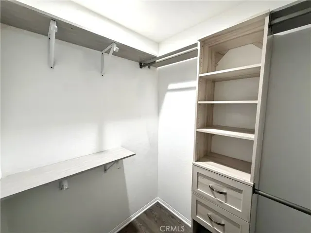 a view of an empty walk in closet