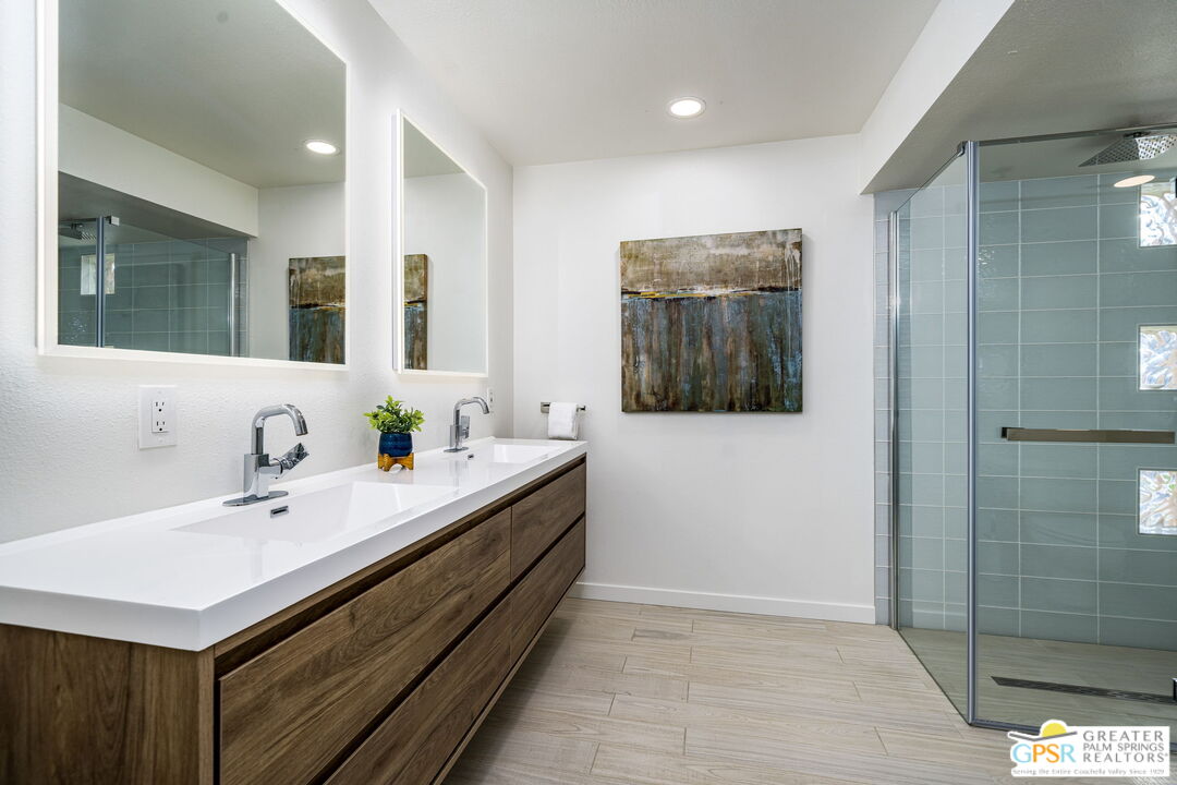 100 East Stevens Road, Unit 513 Palm Springs, CA 92262 - Photo 17 of 26 a bathroom with a sink and a mirror