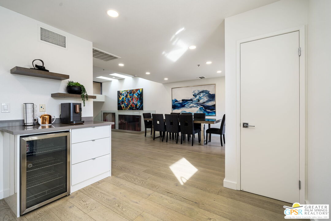 100 East Stevens Road, Unit 513 Palm Springs, CA 92262 - Photo 6 of 26 a kitchen with stainless steel appliances granite countertop a refrigerator and a stove top oven