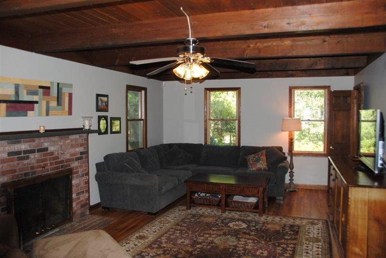 16 Union Church Terrace Rochester, MA 02770 - Photo 7 of 17 a living room with furniture a dining table and a fireplace