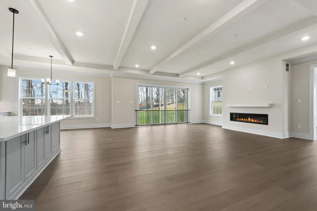 a kitchen with stainless steel appliances granite countertop a stove and a white cabinets
