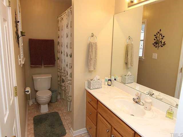 8300 Neuse Rapids Road Raleigh, NC 27616 - Photo 7 of 12 Oak Vanity w/Cultured Marble Sink.