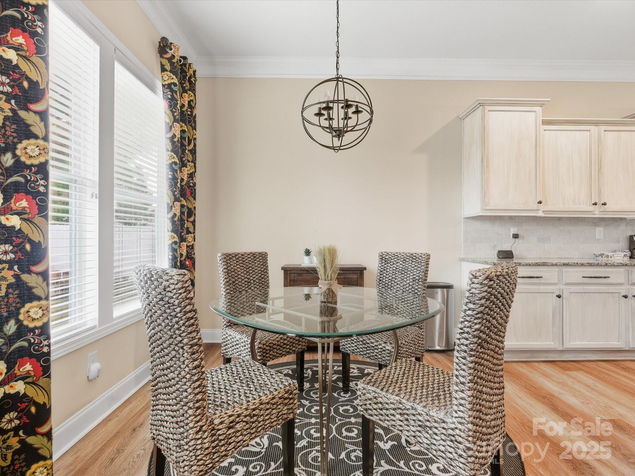 1326 Tupelo Road Clover, SC 29710 - Photo 11 of 40 a view of a dining room with furniture window and wooden floor