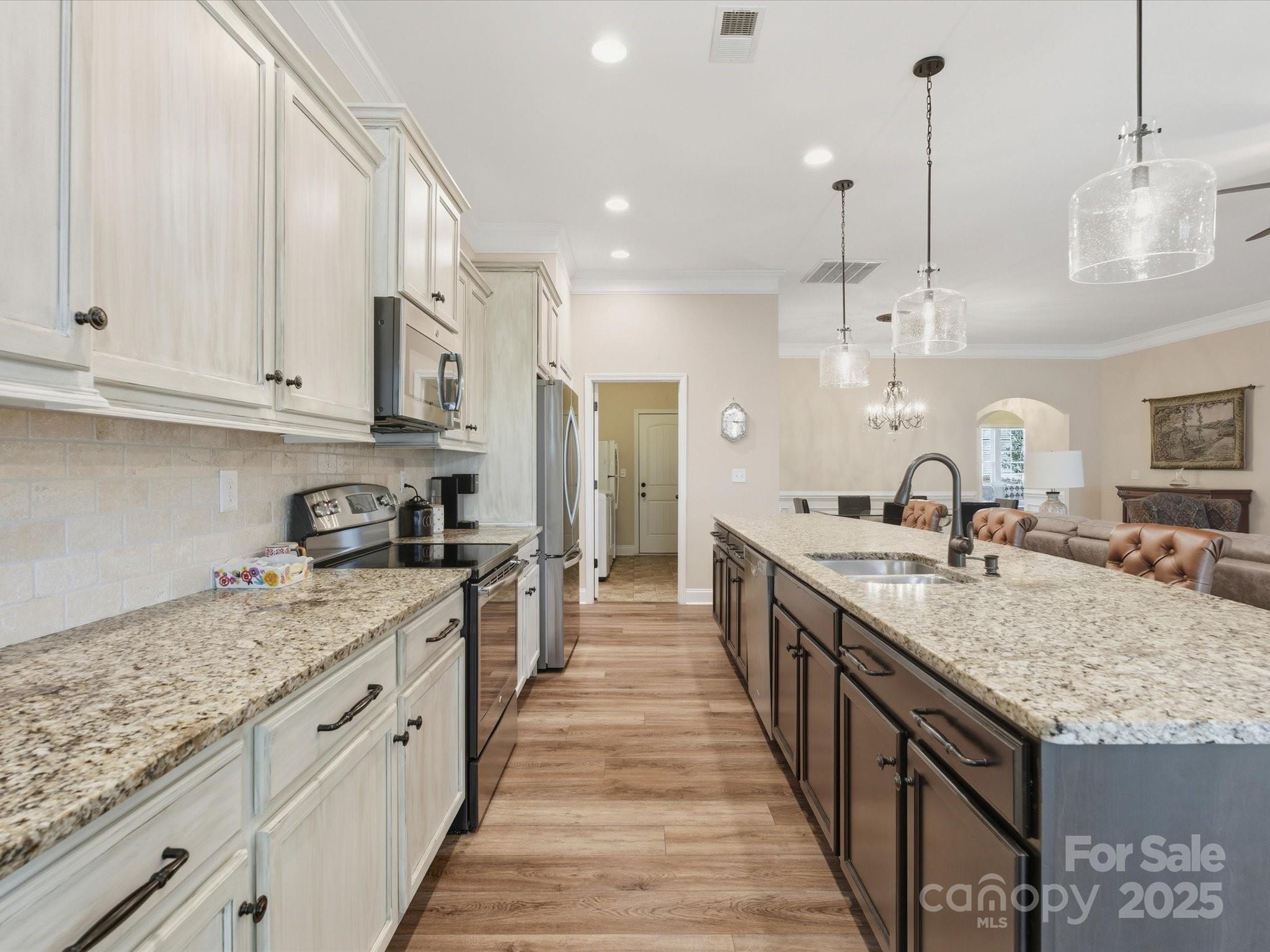 1326 Tupelo Road Clover, SC 29710 - Photo 13 of 40 a large kitchen with granite countertop a sink and a stove