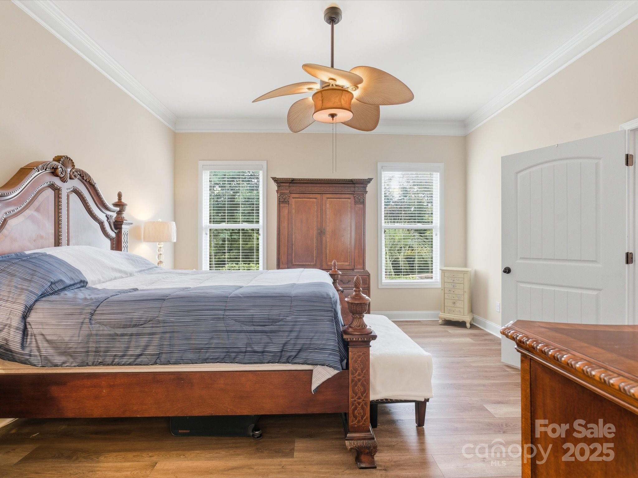 1326 Tupelo Road Clover, SC 29710 - Photo 17 of 40 a bedroom with a bed and a chandelier