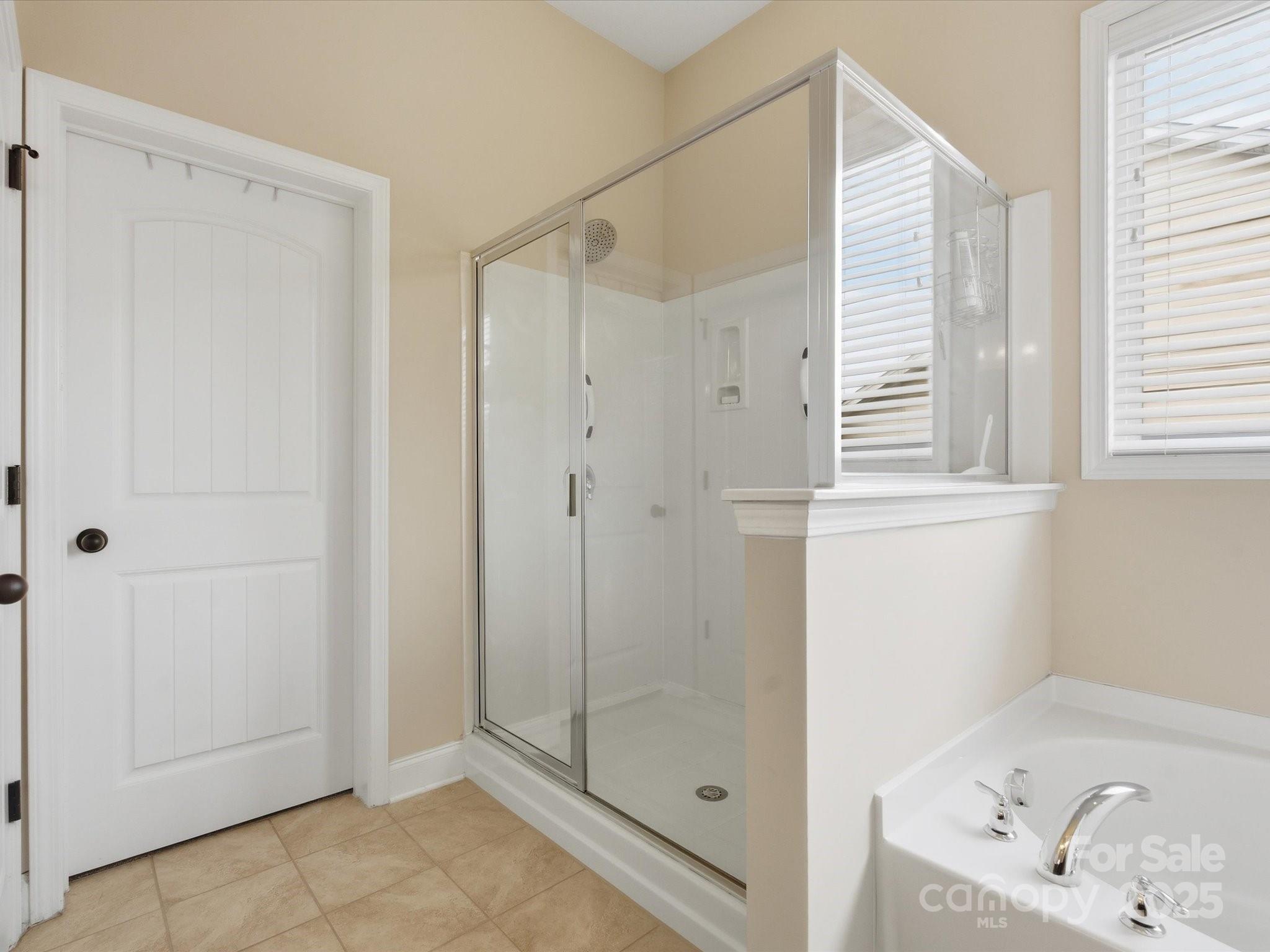1326 Tupelo Road Clover, SC 29710 - Photo 20 of 40 a bathroom with a bathtub and shower