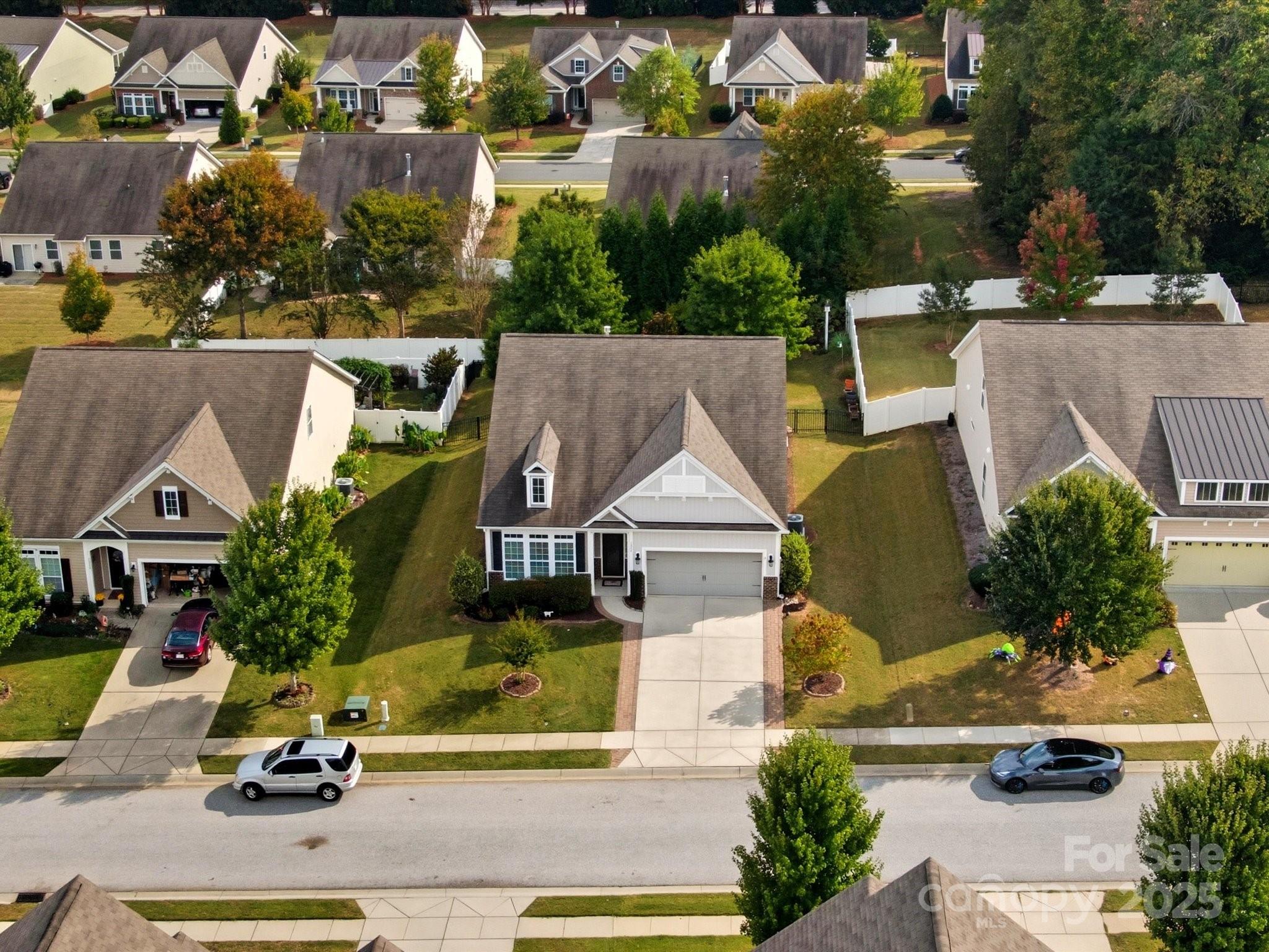 1326 Tupelo Road Clover, SC 29710 - Photo 32 of 40 an aerial view of a house with a garden and car parked