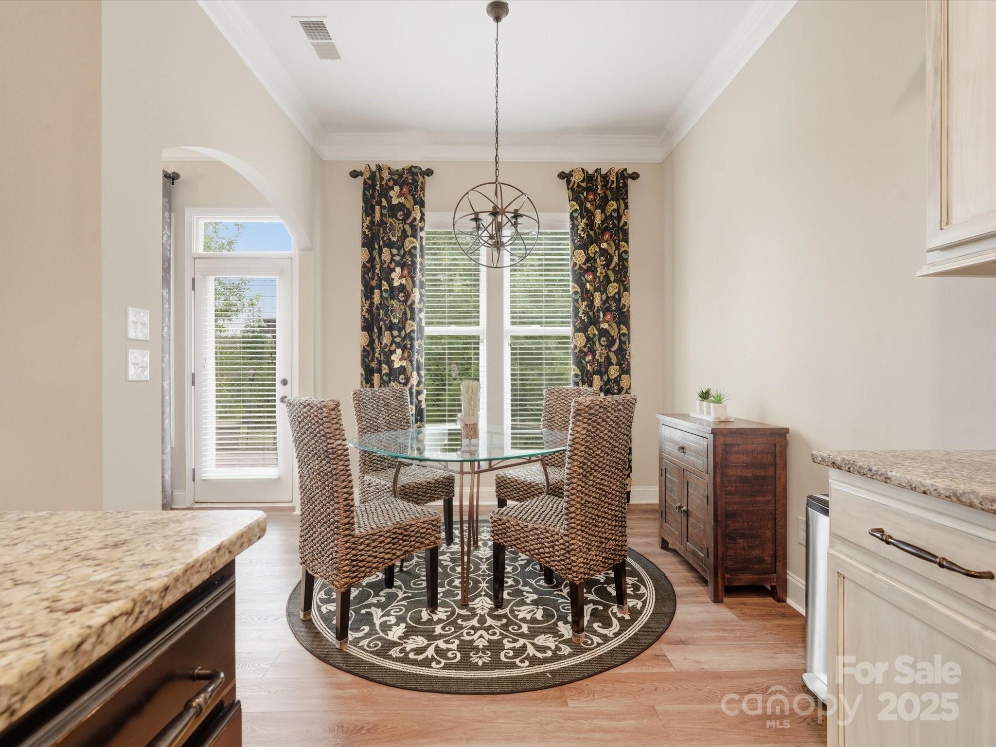 1326 Tupelo Road Clover, SC 29710 - Photo 10 of 40 a view of a dining room with furniture window and wooden floor