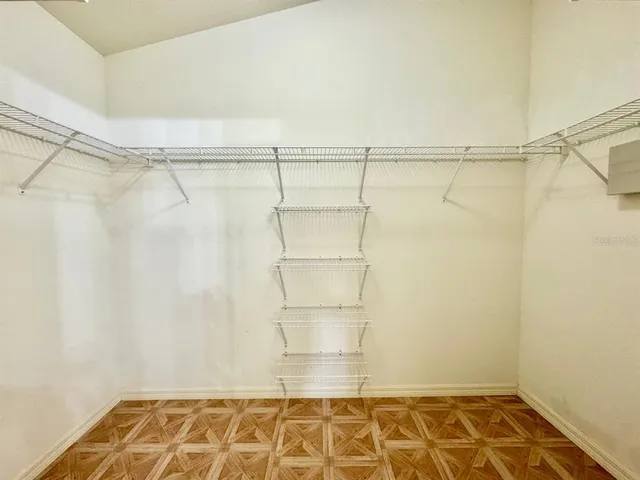 a view of an empty walk in closet