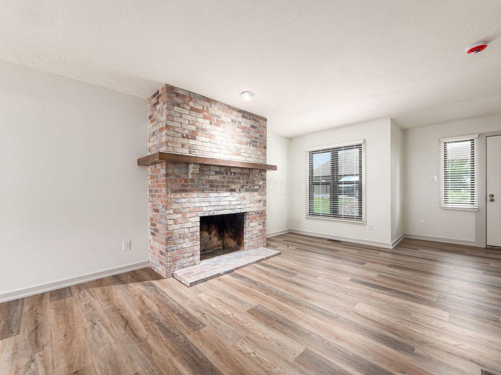 428 Edinburgh Road Dublin, OH 43017 - Photo 6 of 24 Whitewashed fireplace