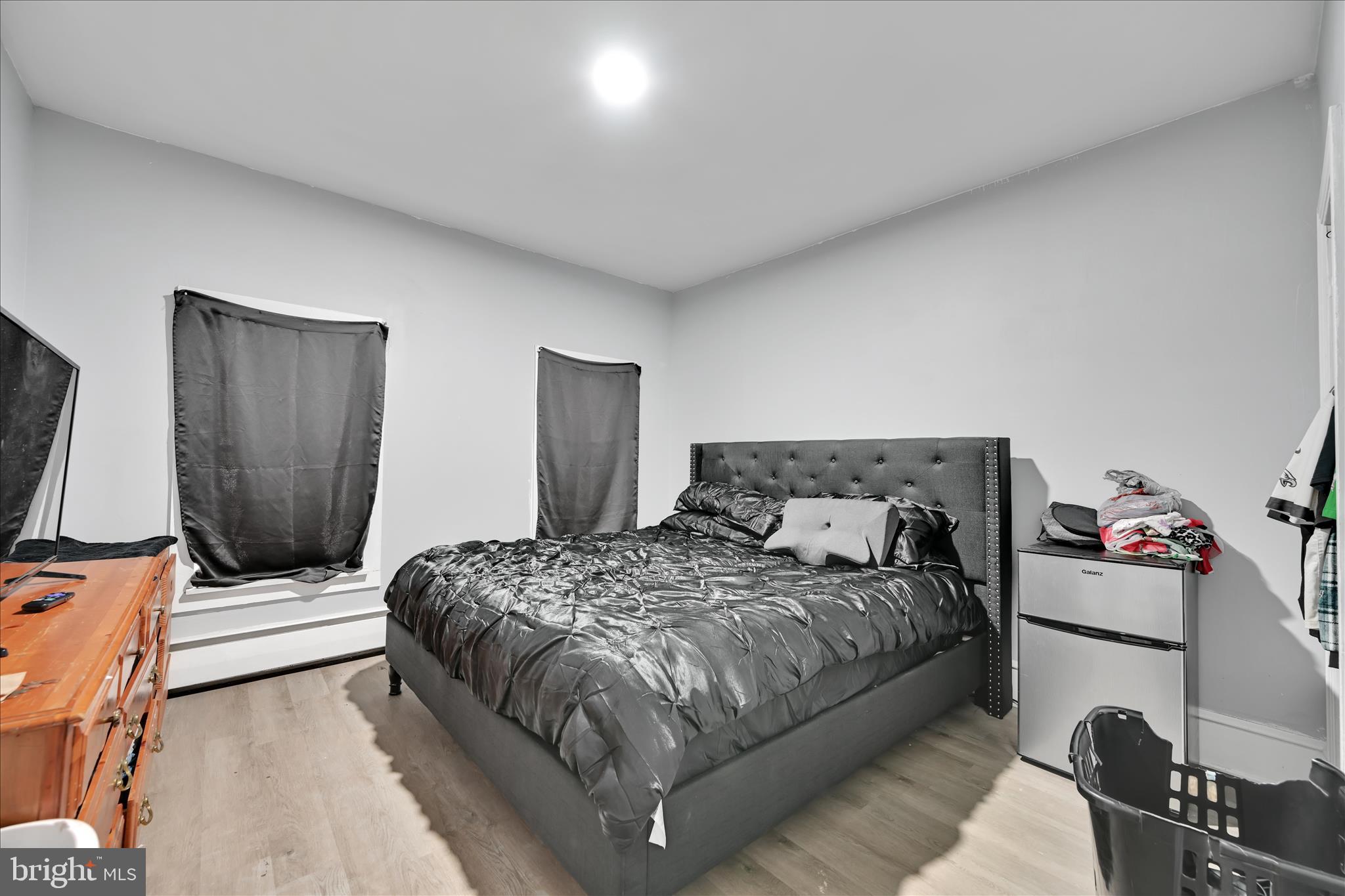 535 East Centre Street Mahanoy City, PA 17948 - Photo 12 of 26 a bedroom with a bed and a flat tv screen on a dresser