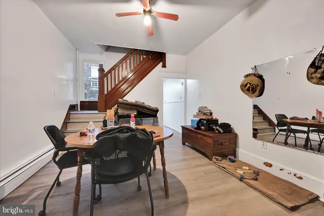 a living room with furniture and a clock