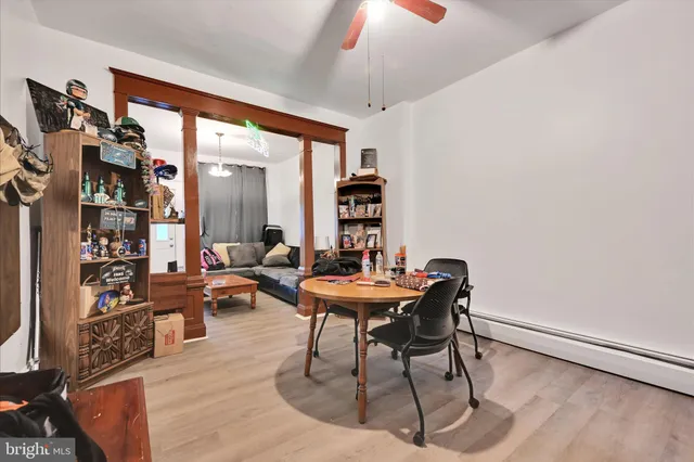 a living room with furniture a rug and a large window