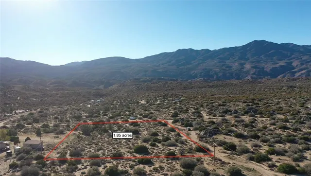 an aerial view of residential house and green space