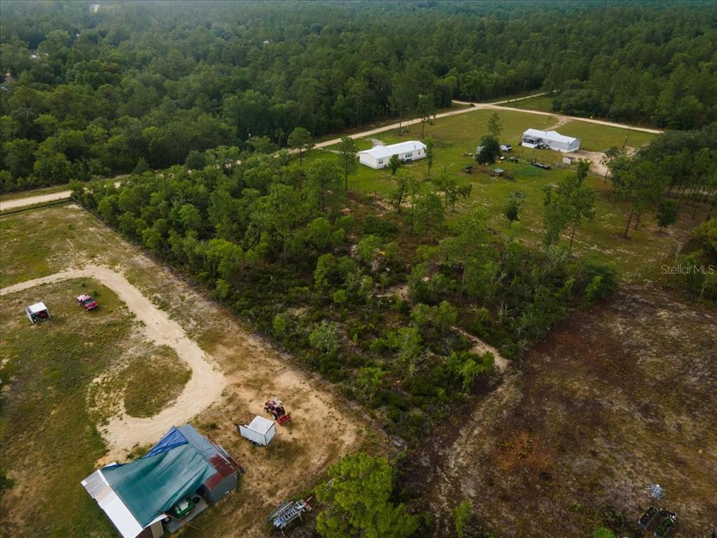 Northeast 154th Avenue Williston, FL 32696 - Photo 2 of 5 an aerial view of residential houses with outdoor space
