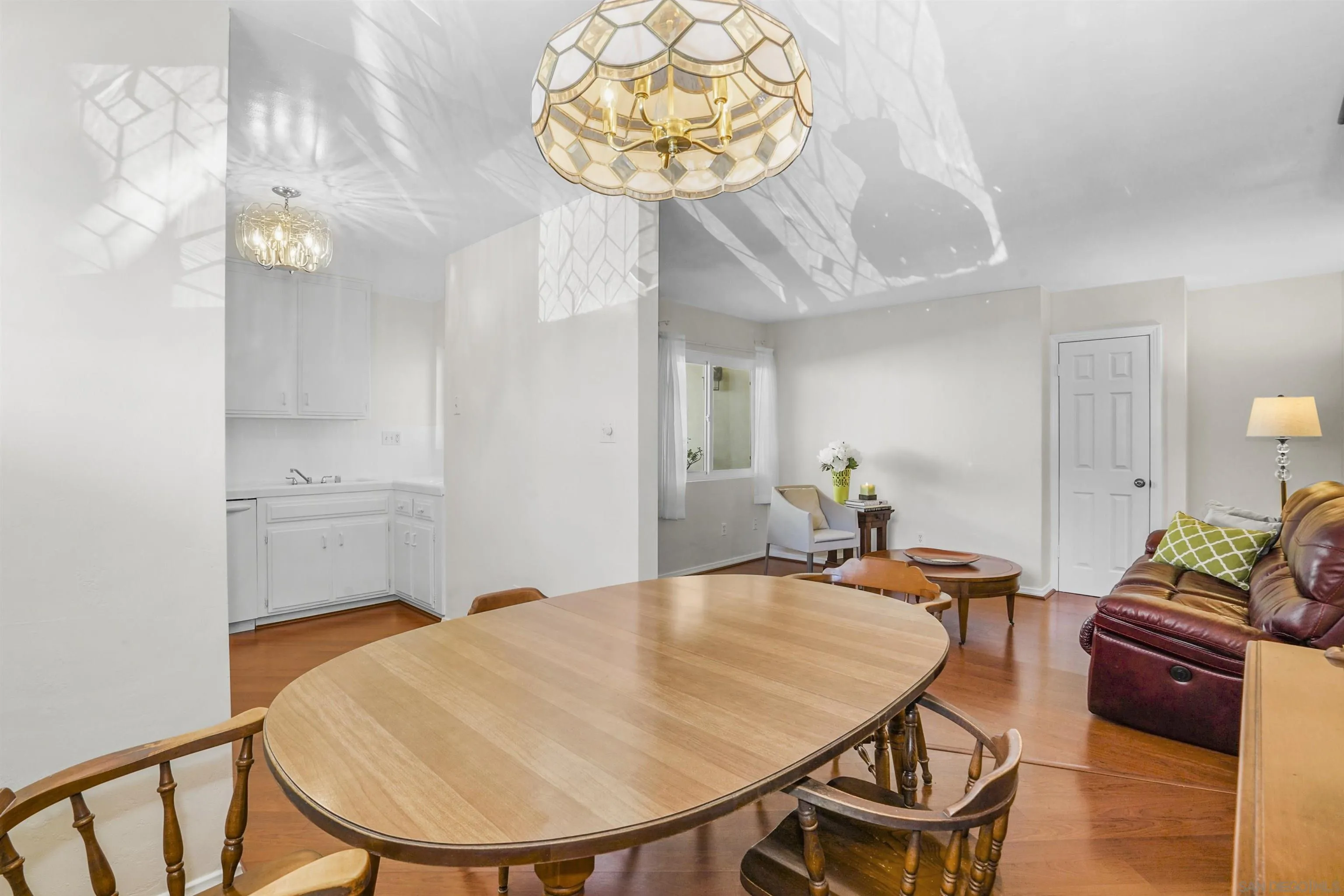 734 E Avenue Coronado, CA 92118 - Photo 11 of 30 a view of a dining room with furniture