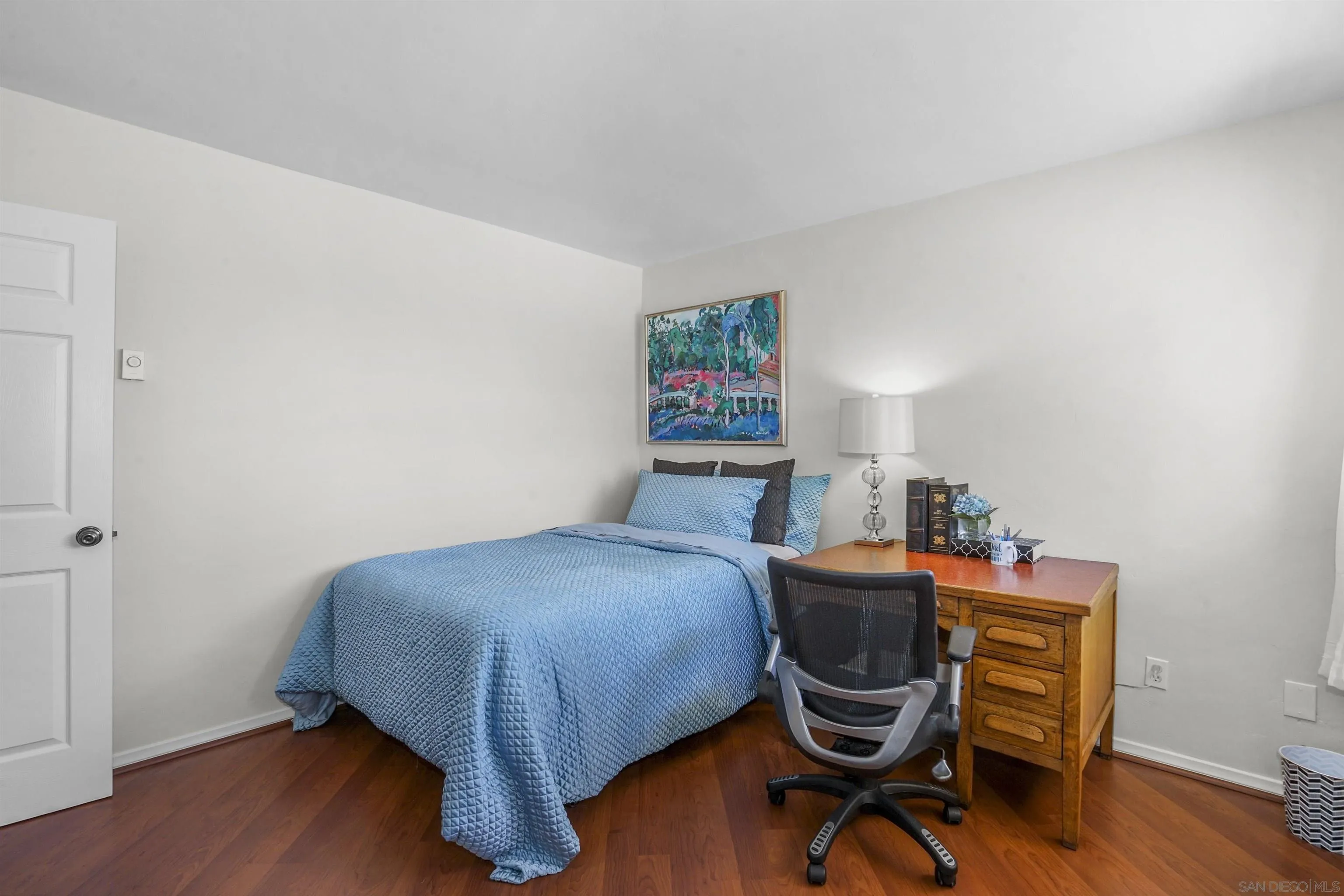 734 E Avenue Coronado, CA 92118 - Photo 20 of 30 a bedroom with a bed and a desk