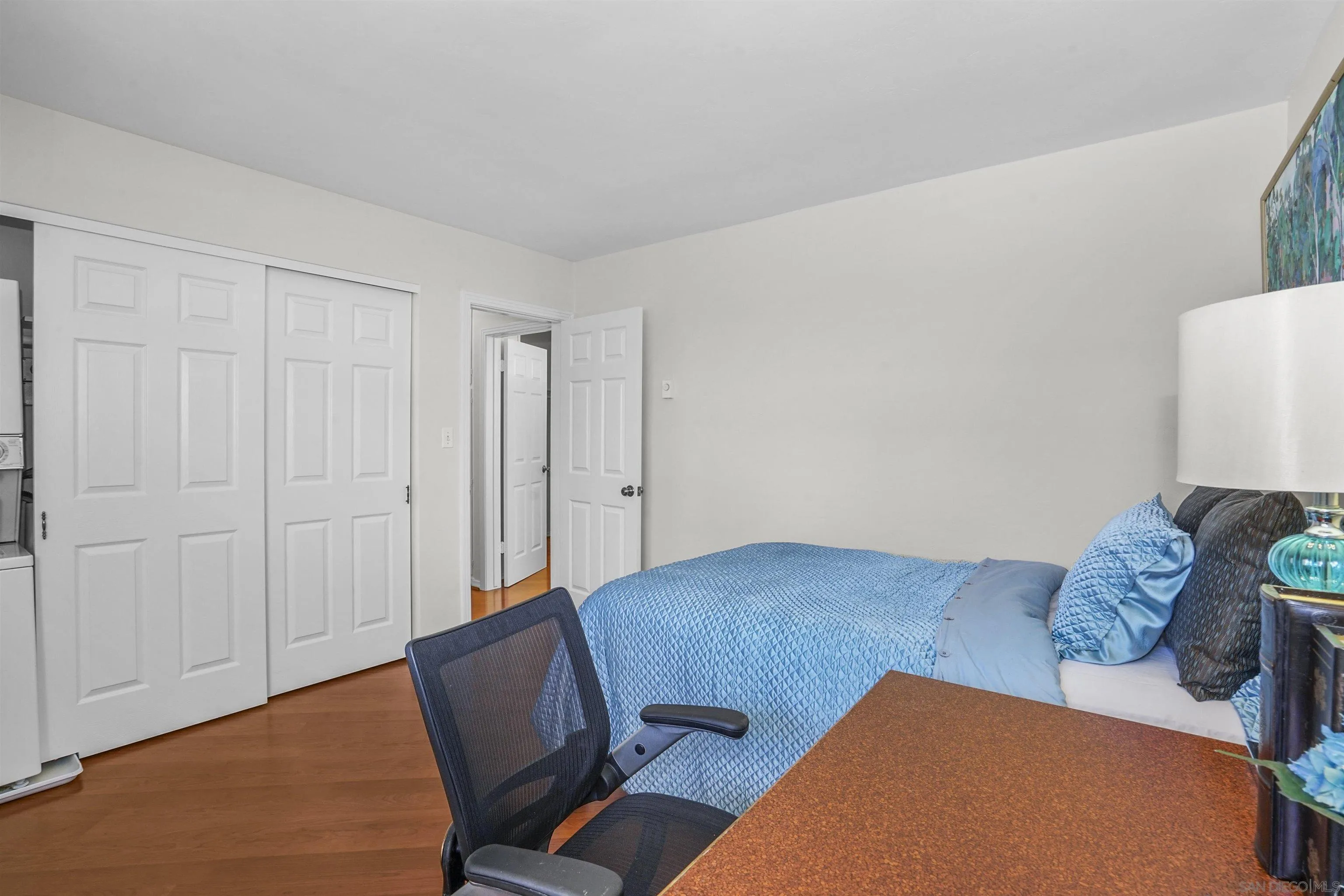 734 E Avenue Coronado, CA 92118 - Photo 21 of 30 a living room with furniture rug and wooden floor