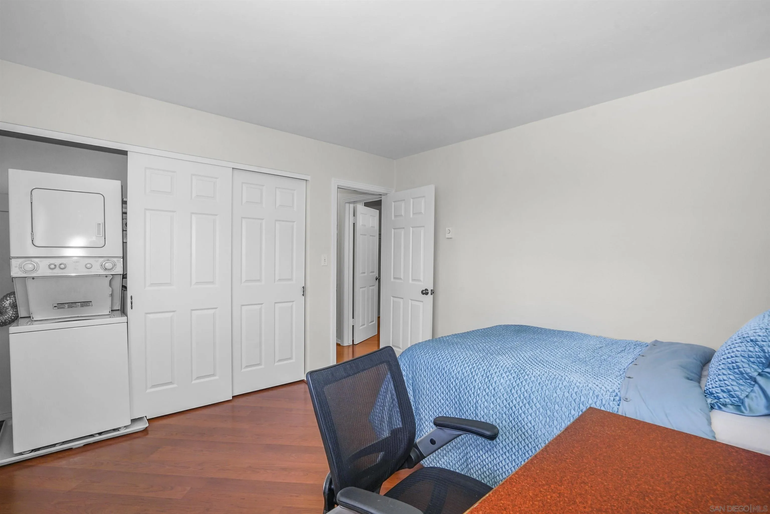 734 E Avenue Coronado, CA 92118 - Photo 22 of 30 a living room with furniture rug and wooden floor