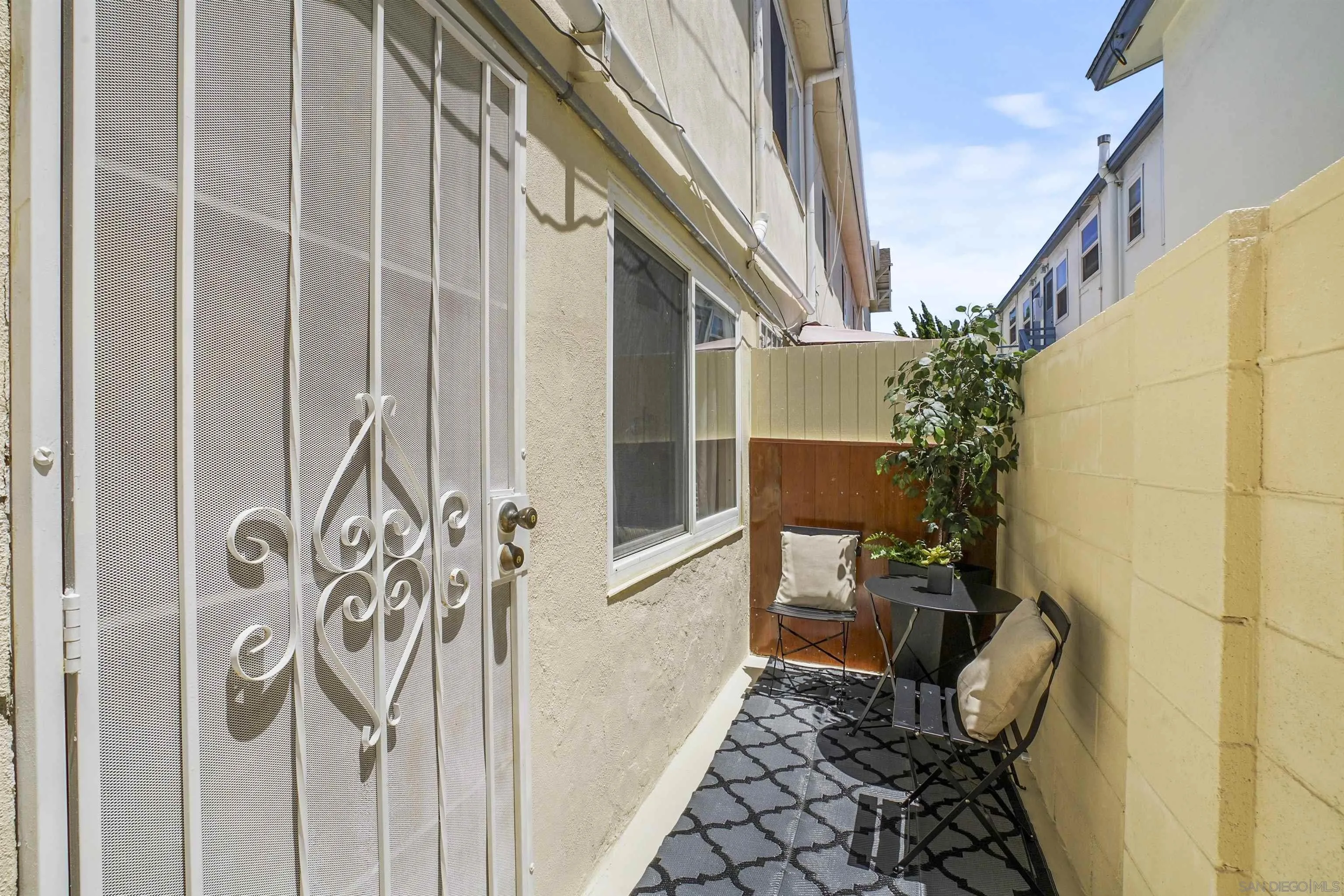 734 E Avenue Coronado, CA 92118 - Photo 24 of 30 a porch with a table and chairs