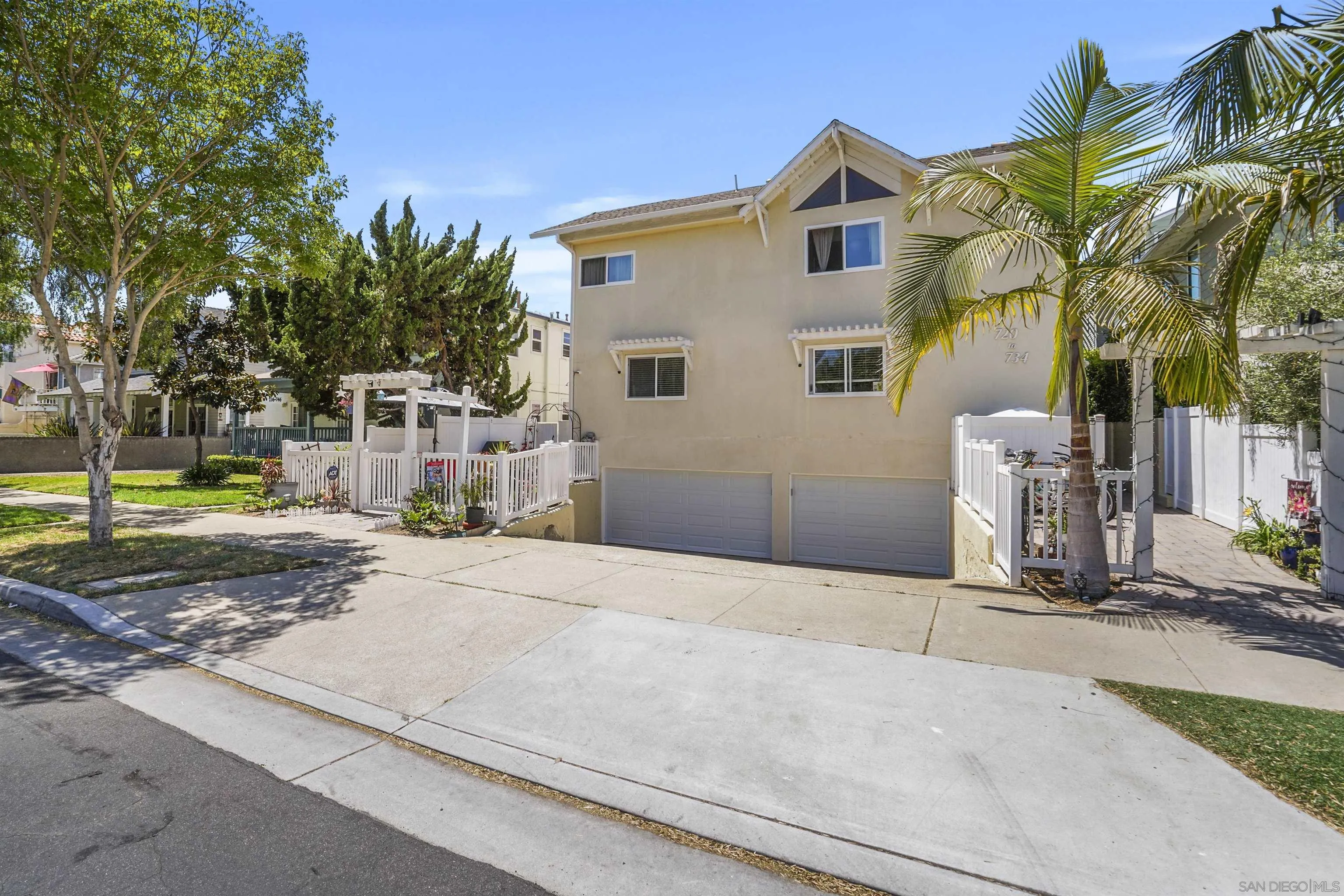 734 E Avenue Coronado, CA 92118 - Photo 30 of 30 a front view of a house with a yard and garage