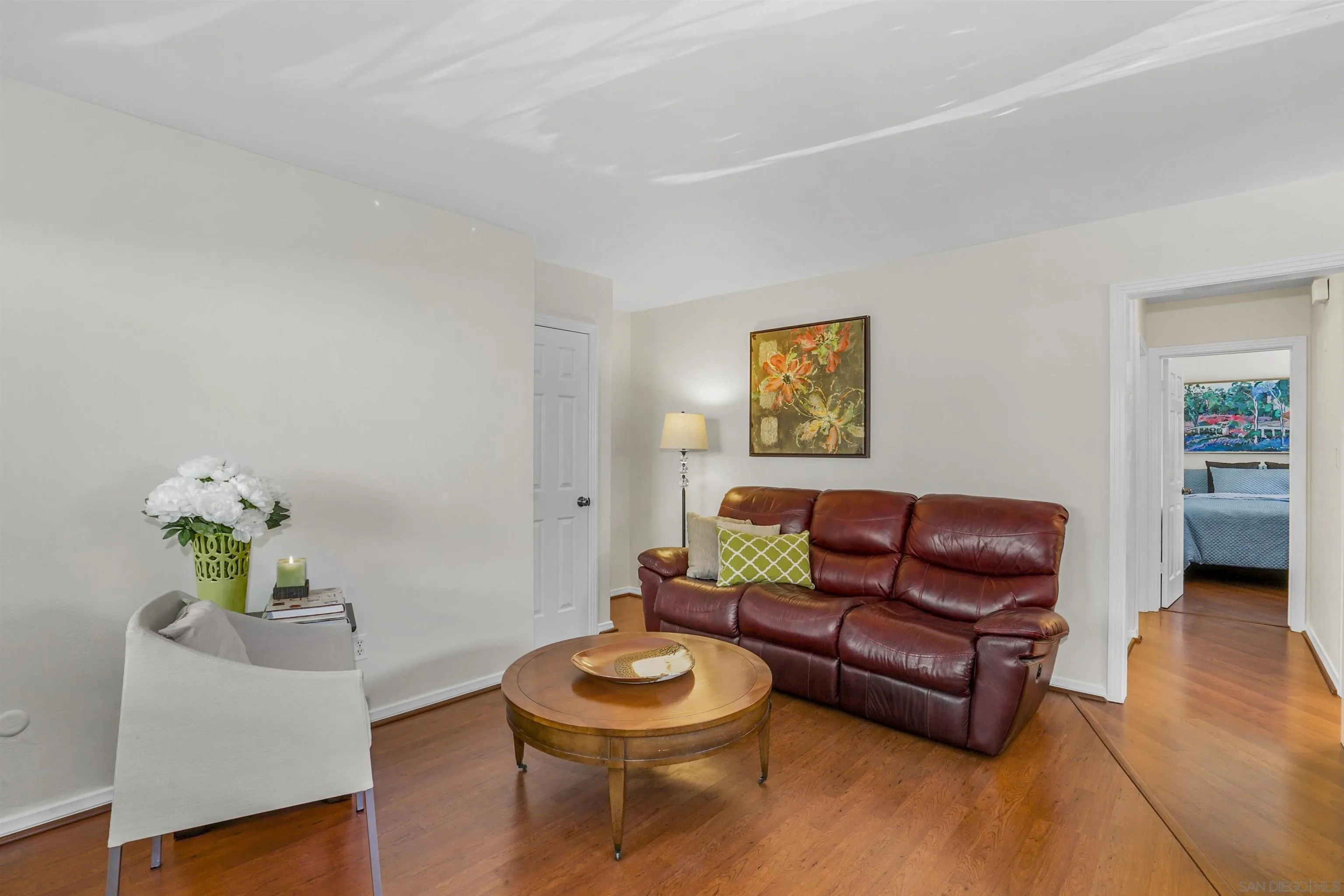 734 E Avenue Coronado, CA 92118 - Photo 3 of 30 a living room with furniture and a wooden floor