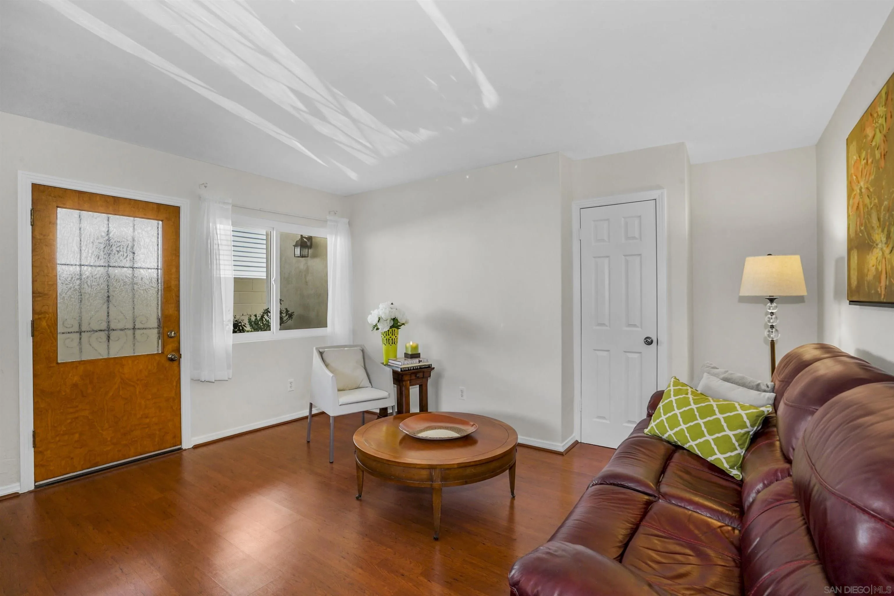 734 E Avenue Coronado, CA 92118 - Photo 6 of 30 a living room with furniture and wooden floor