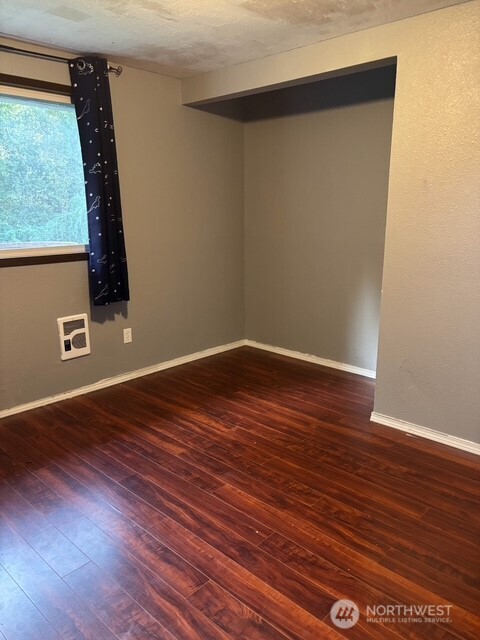9735 Littlerock Road Southwest Olympia, WA 98512 - Photo 12 of 30 a view of a room with wooden floor and cabinet