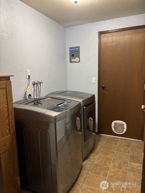 9735 Littlerock Road Southwest Olympia, WA 98512 - Photo 19 of 30 a utility room with dryer and washer