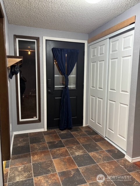9735 Littlerock Road Southwest Olympia, WA 98512 - Photo 2 of 30 a view of a entryway door with a glass door