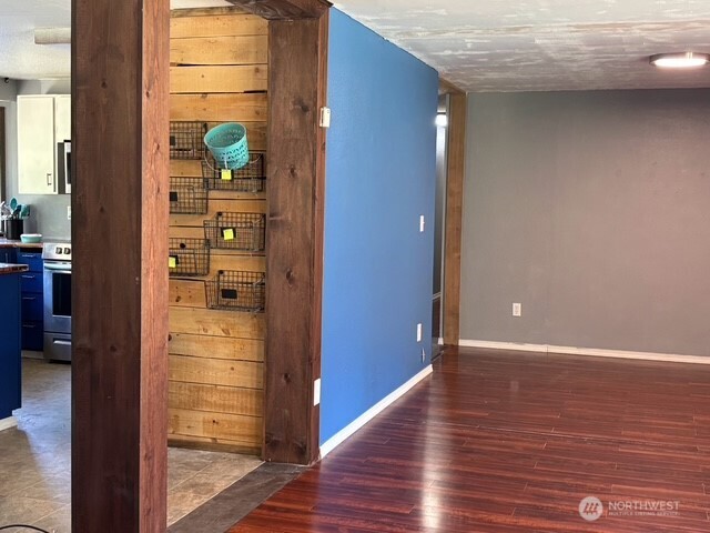 9735 Littlerock Road Southwest Olympia, WA 98512 - Photo 5 of 30 a view of hallway with wooden floor