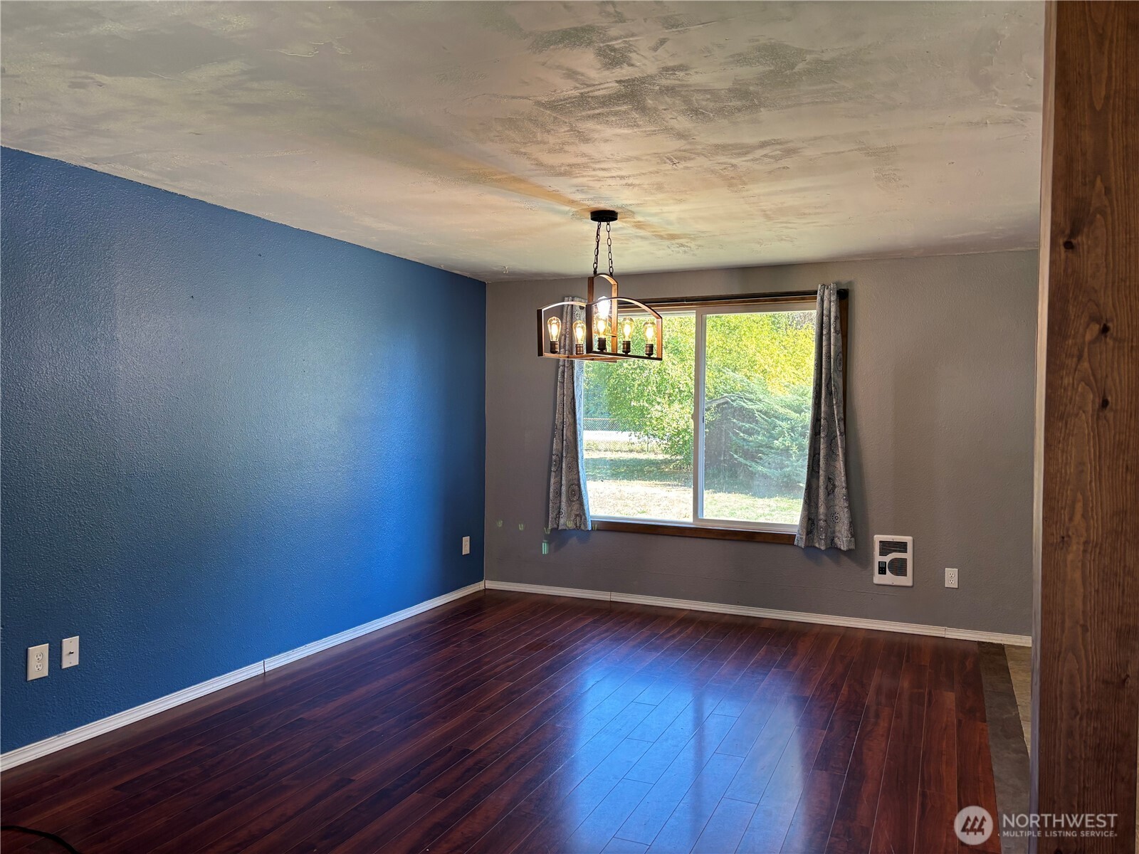 9735 Littlerock Road Southwest Olympia, WA 98512 - Photo 7 of 30 an empty room with wooden floor and windows